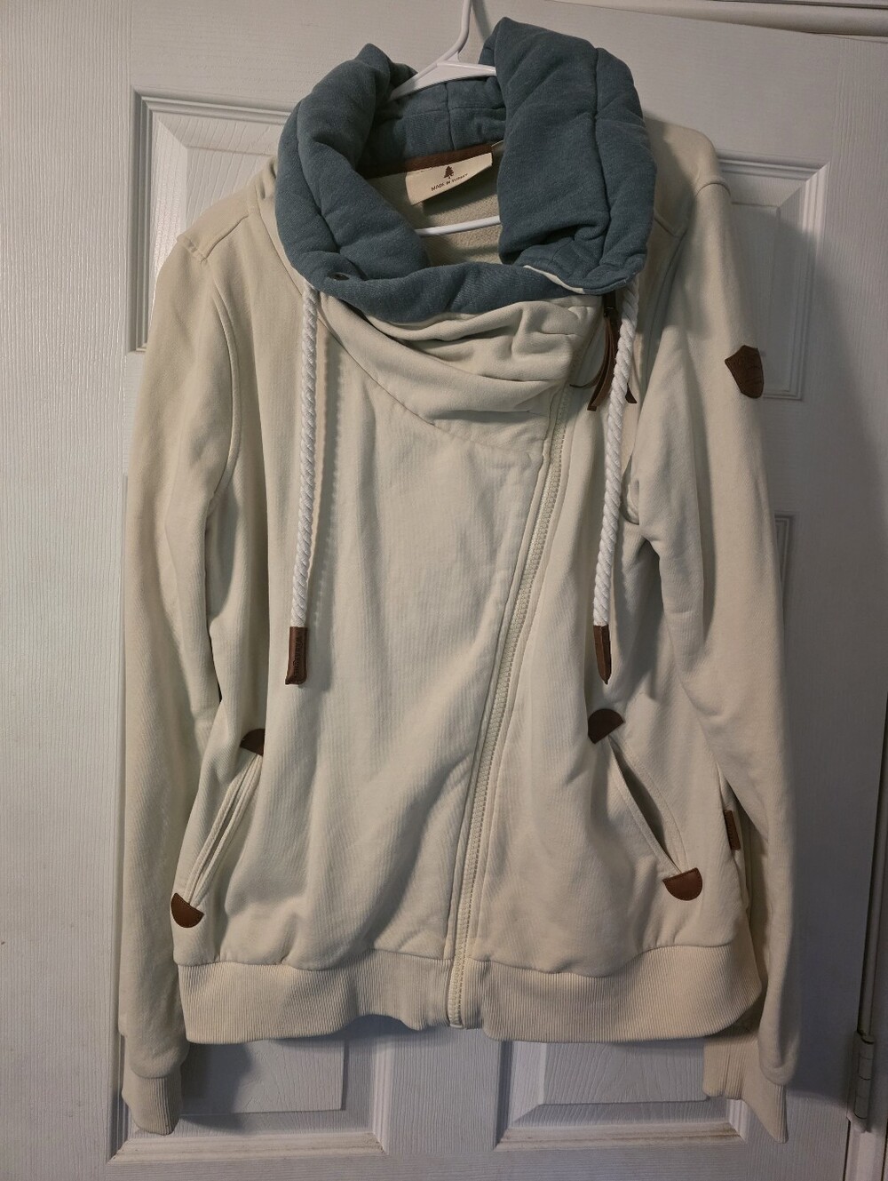 Wanakome Cream Hoodie with Teal Cowl and Leather Accents